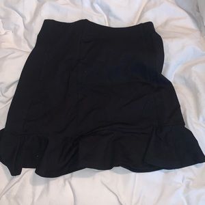 Black ruffle mini skirt